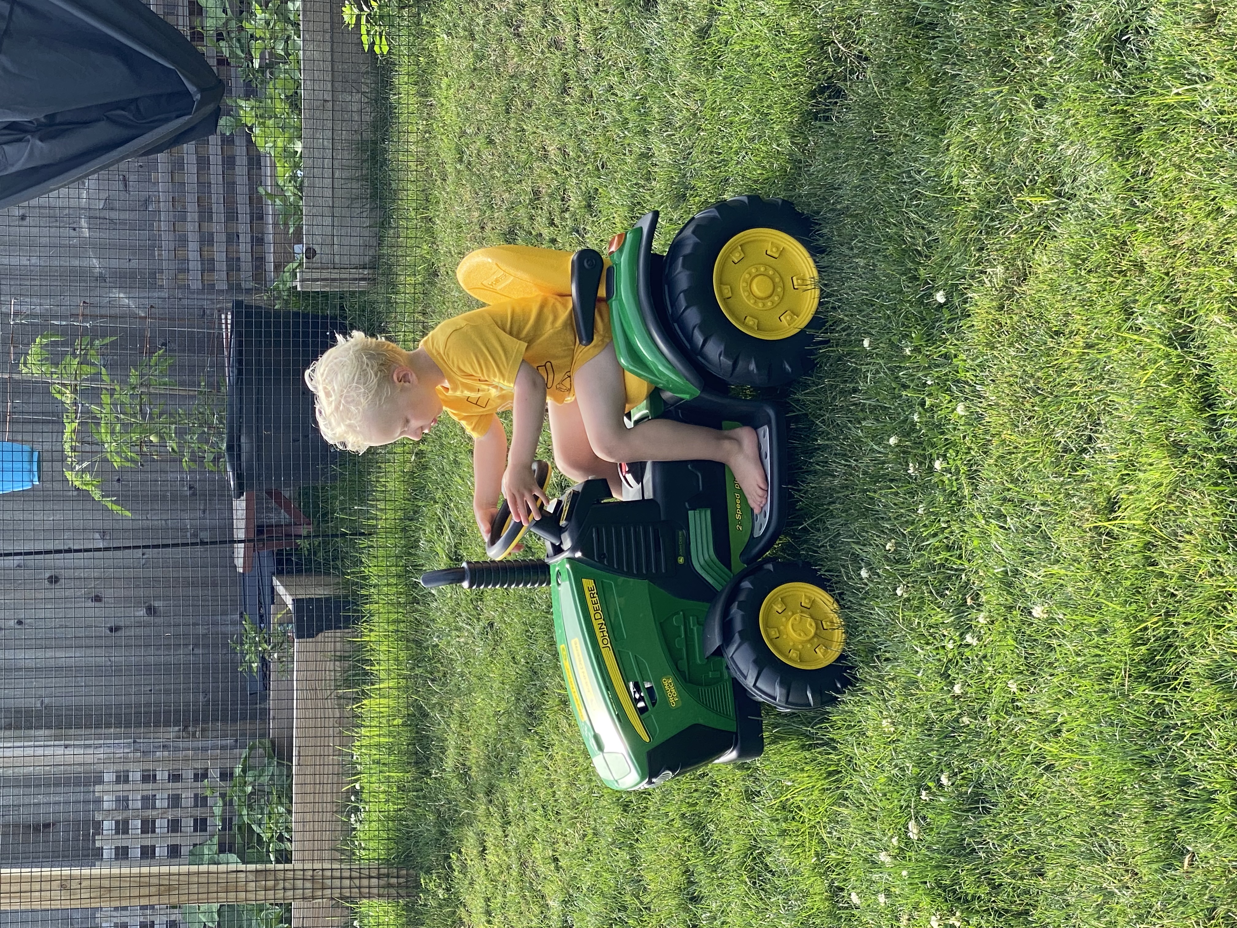 Owen on a John Deere tractor