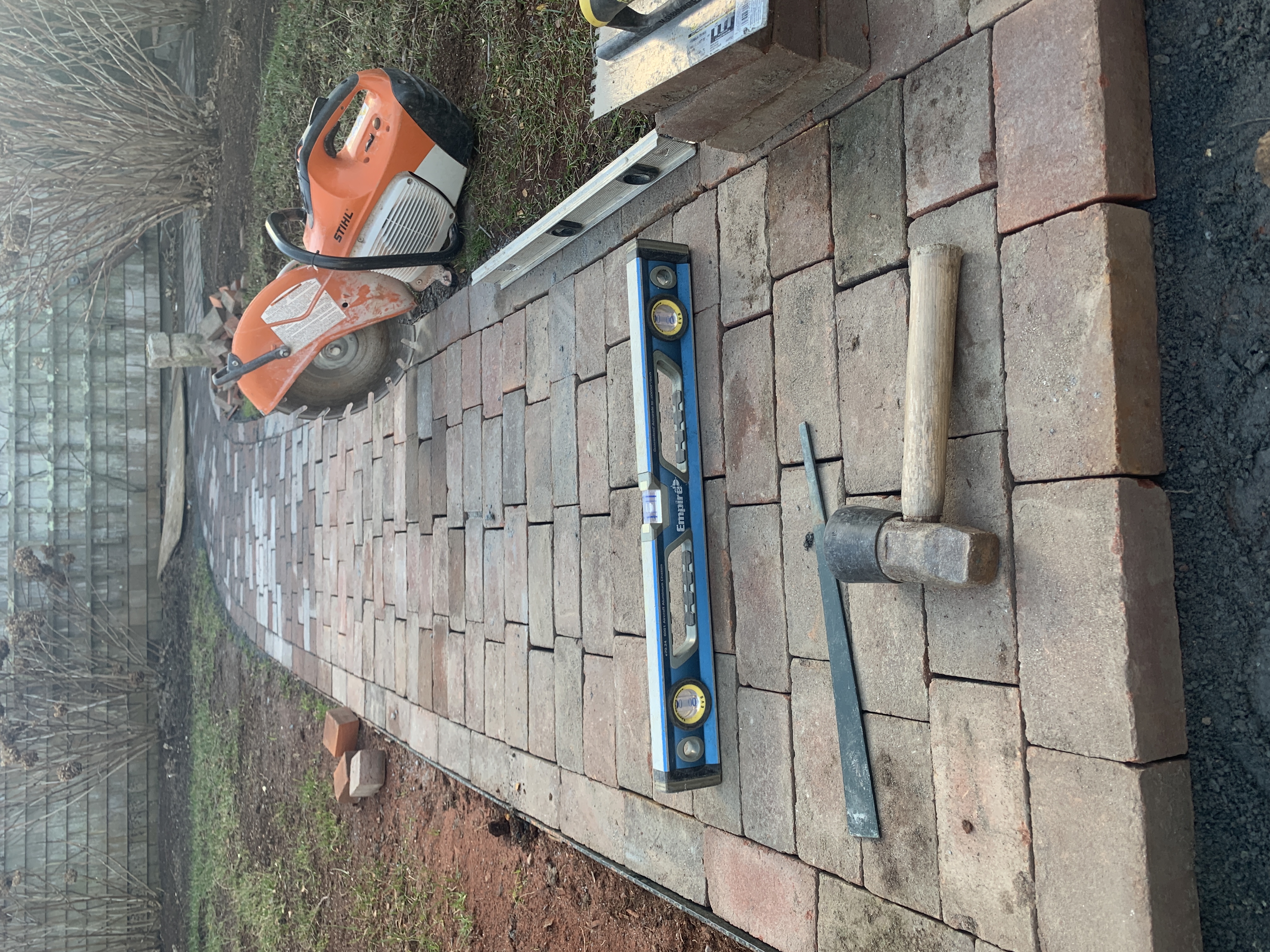 Paver walkway installation with tools